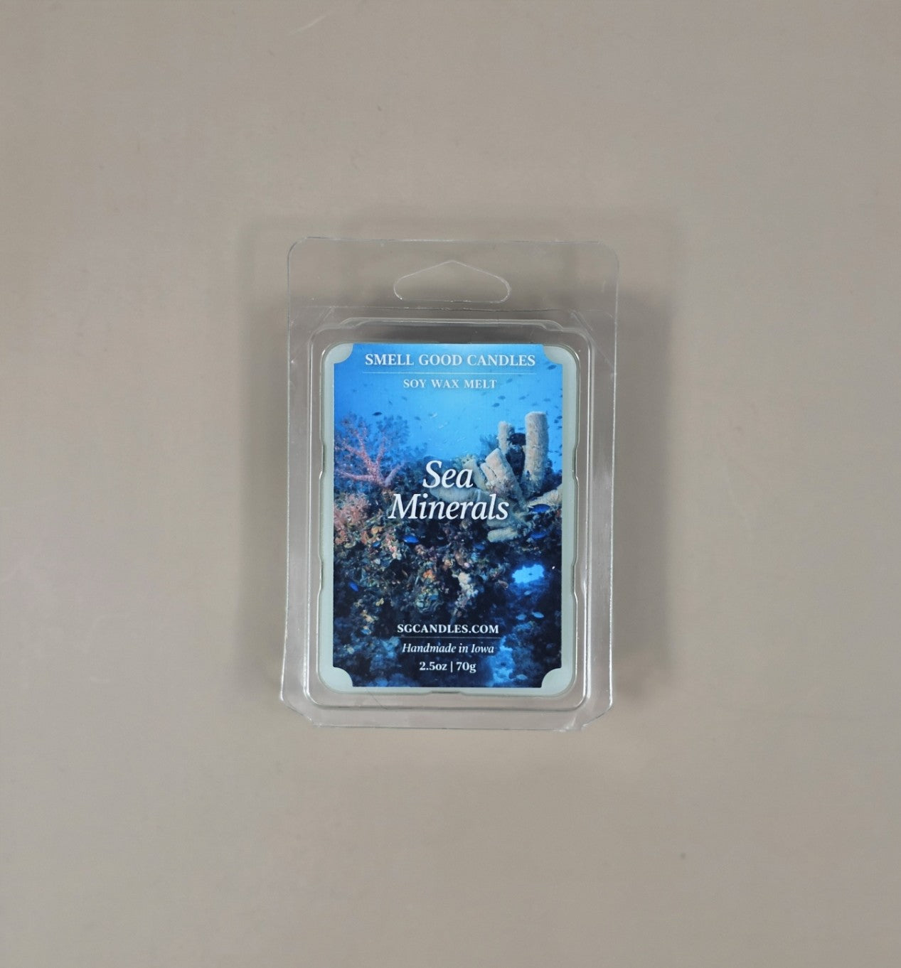 Packaged wax melt with 'Sea Minerals' design on a plain background