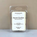 Secret Garden wax melt by Smell Good Candles, featuring a blooming floral bouquet of Honeysuckle, Jasmine, Water Lily, and Sandalwood.