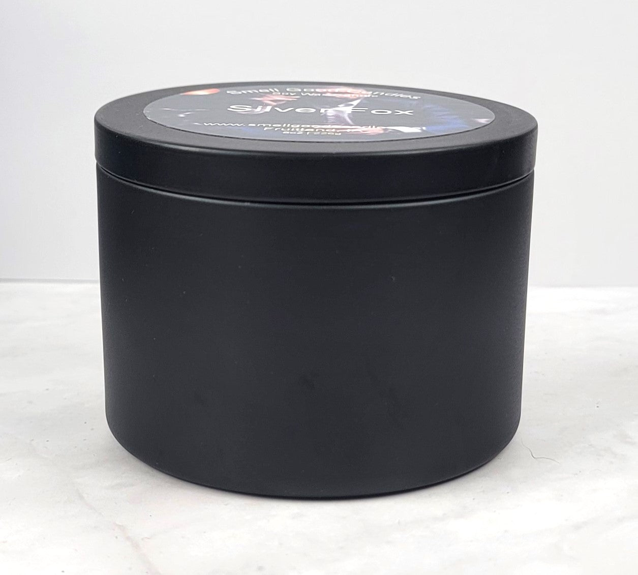 Elegant Silver Fox candle with bold citrus and wood fragrance