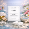 Solstice white soy wax melts by Smell Good Candles in a clear rectangular clamshell with scalloped white label and six white wax melt cubes on a bright modern floral background.
