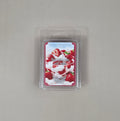 Strawberries and Cream wax melt package on a gray background