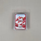 Strawberries and Cream wax melt package on a gray background