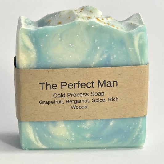 The Perfect Man cold process natural soap bar with brown paper label featuring masculine scent notes of grapefruit, bergamot, spice, and rich woods from Smell Good Candles in Fruitland, Iowa.