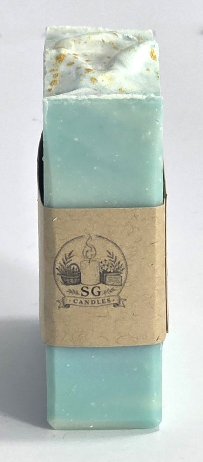Smell Good Candles brand logo printed on the side paper band of a small-batch artisan soap bar.