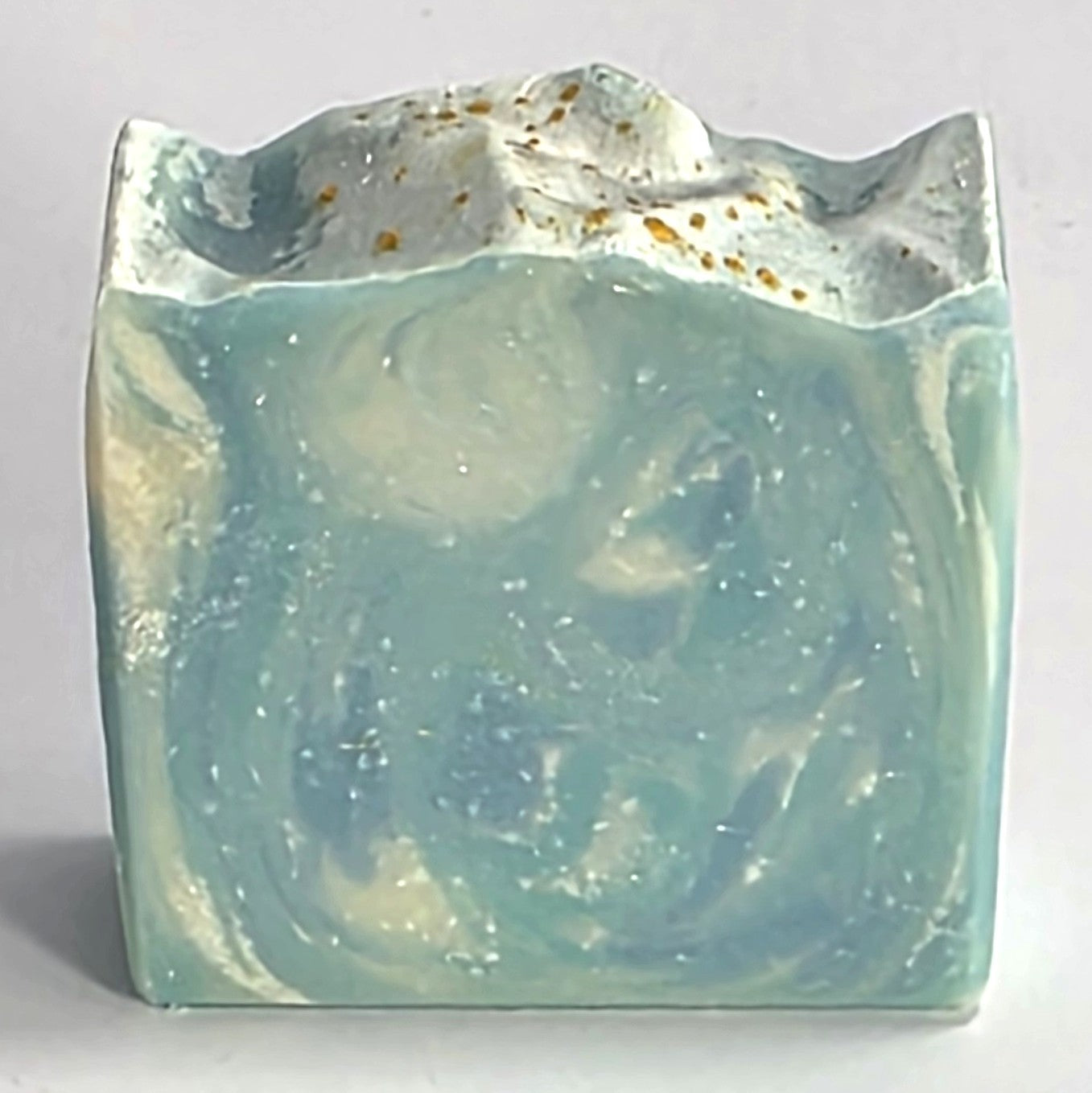 Textured top with gold mica shimmer and blue and white marbled design of a handcrafted The Perfect Man cold process soap bar.