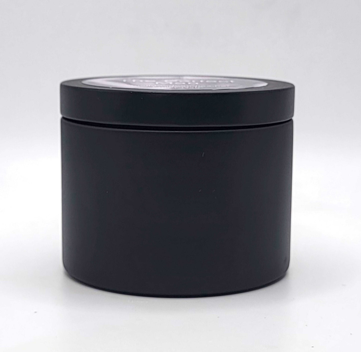 The Perfect Man 4oz Soy Candle in black candle tin showing side profile