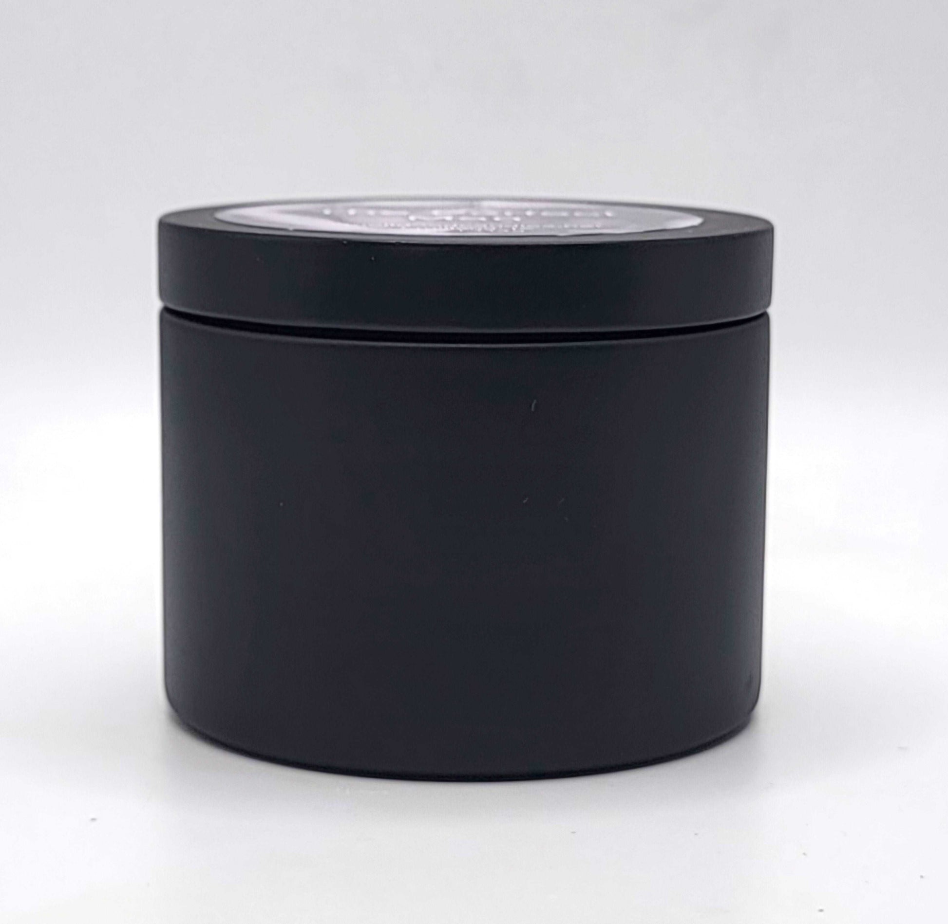 The Perfect Man 4oz Soy Candle in black candle tin showing side profile