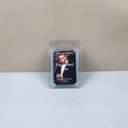 Packaged candle labeled 'The Perfect Man' on a plain background