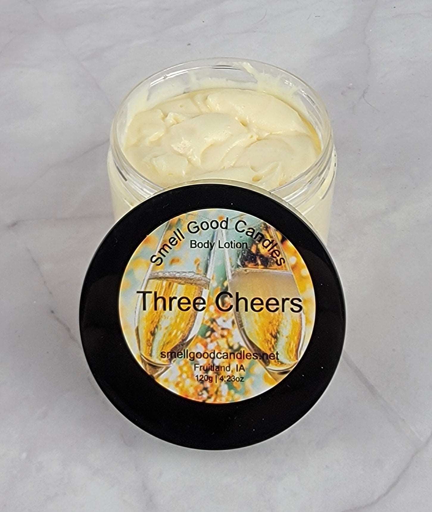 Three Cheers Whipped Body Lotion with sparkling champagne and fruity scent.