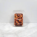 Tobacco soy wax melt with dark woods and leather backdrop