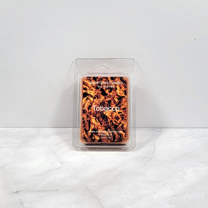 Tobacco soy wax melt with dark woods and leather backdrop