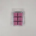 Pack of six pink wax melts in a clear plastic packaging on a light gray background