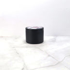 Dark aesthetic candle with blood-red berry fragrance