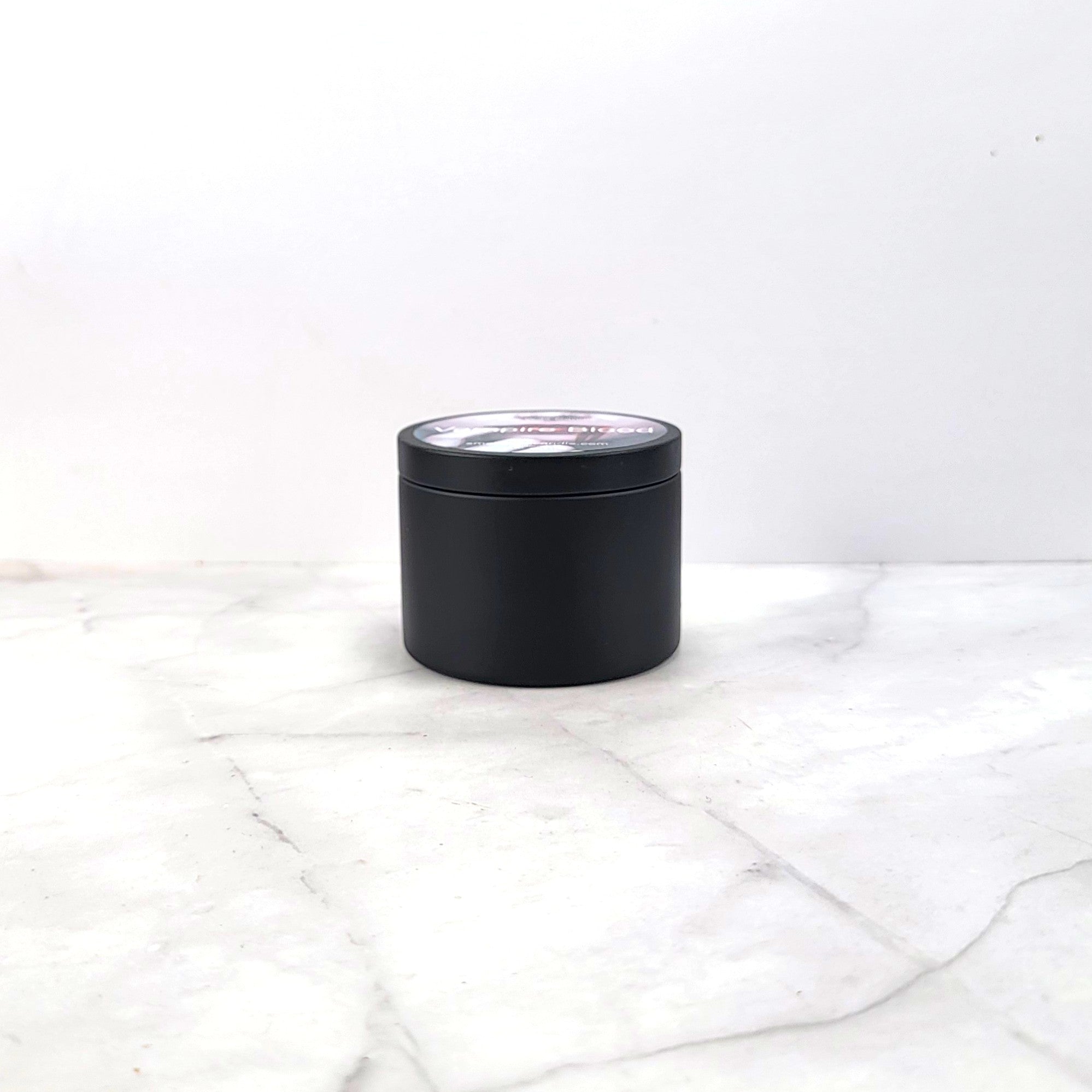 Dark aesthetic candle with blood-red berry fragrance