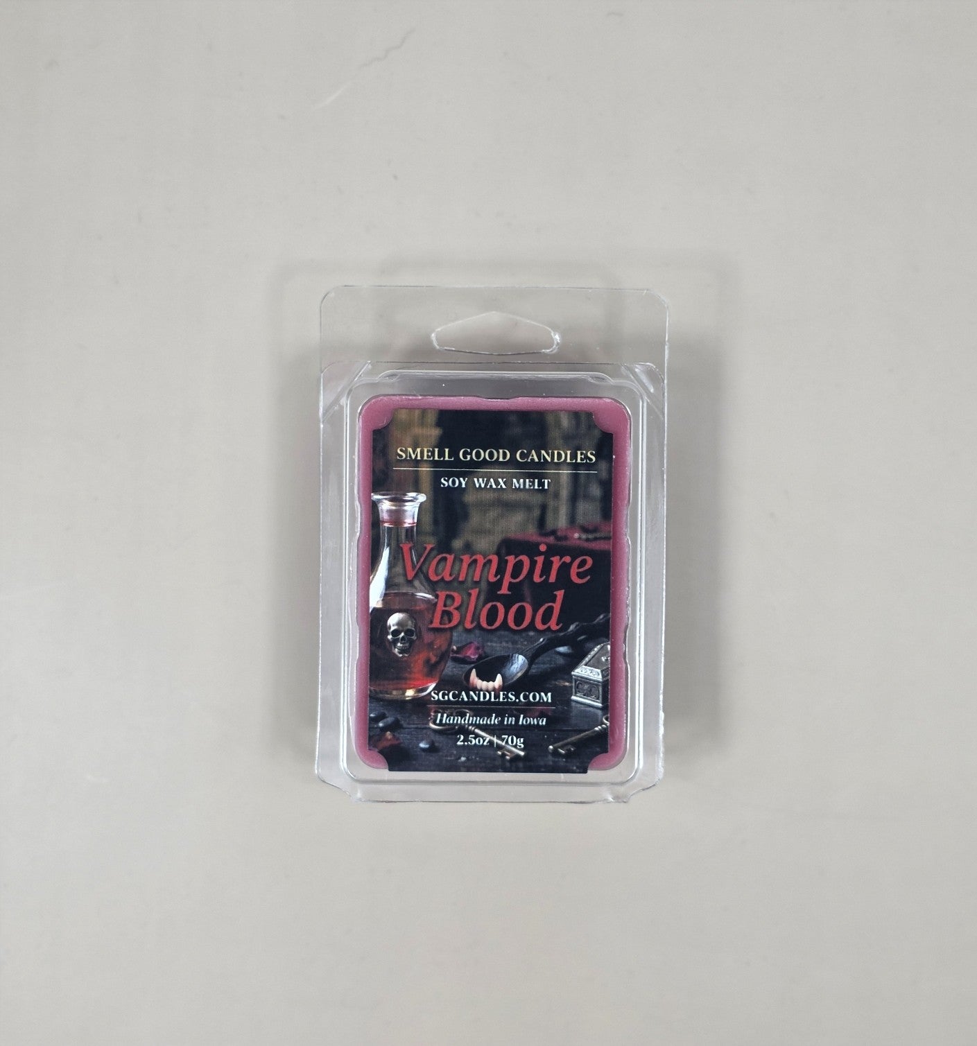 Soy wax melt package labeled 'Vampire Blood' by Smell Good Candles on a gray background