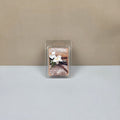 Wax melt packaging with floral design on a neutral background