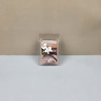 Wax melt packaging with floral design on a neutral background