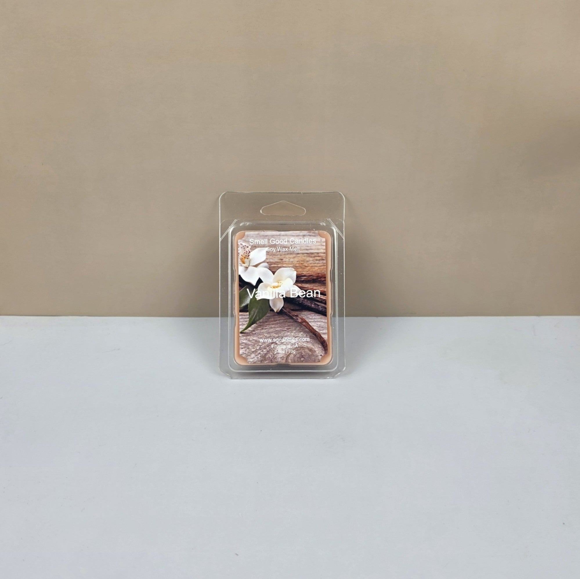 Wax melt packaging with floral design on a neutral background