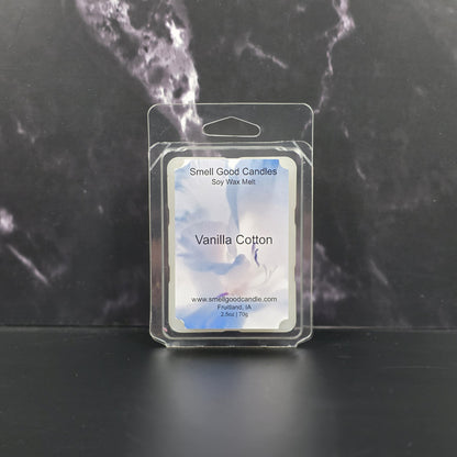 Packaged vanilla cotton soy wax melt with 'Smell Good Candles' label on a dark marble background