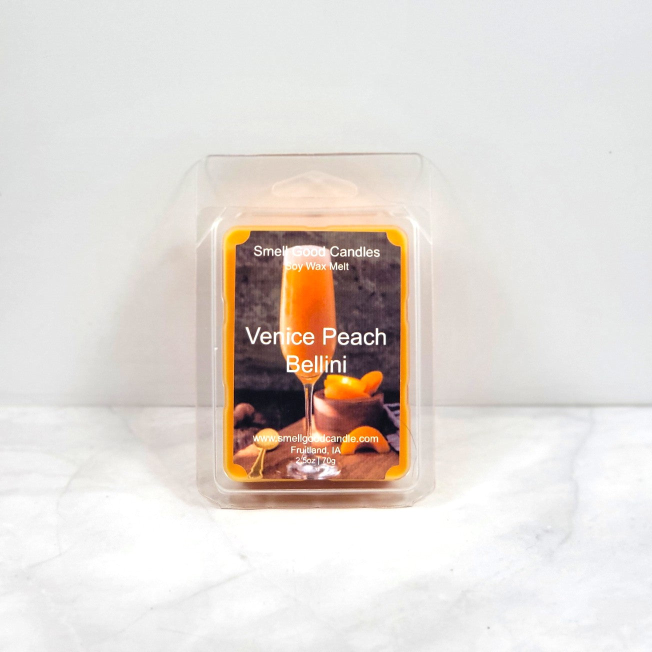 Wax melt packaging labeled 'Venice Peach Bellini' on a white background