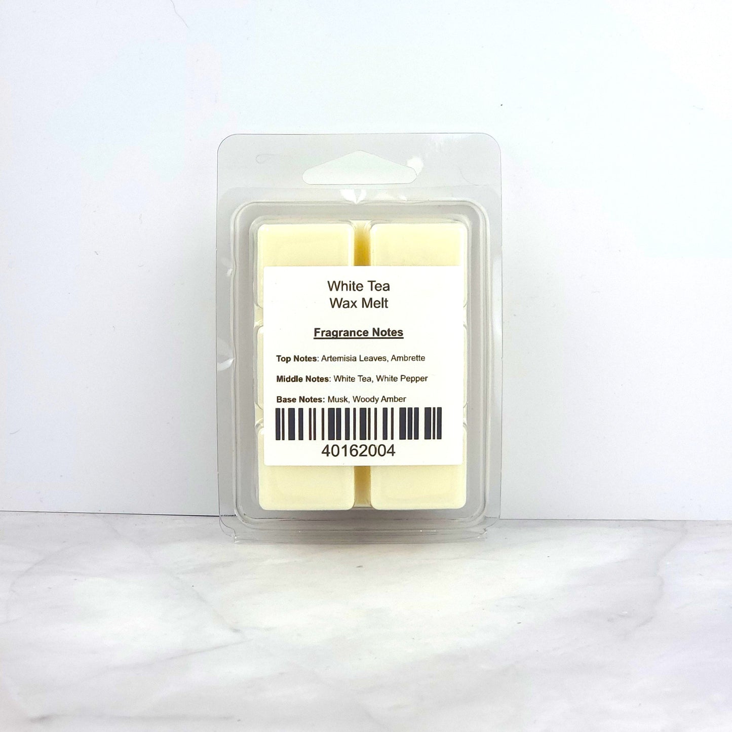 Hand-poured 2.5oz White Tea Soy Wax Melt inspired by Bvlgari for a luxurious, unisex fragrance with musk and woody amber.