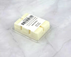 Luxurious White Tea Soy Wax Melt with herbaceous artemisia, white tea, and refined woody amber for a tranquil home ambiance.