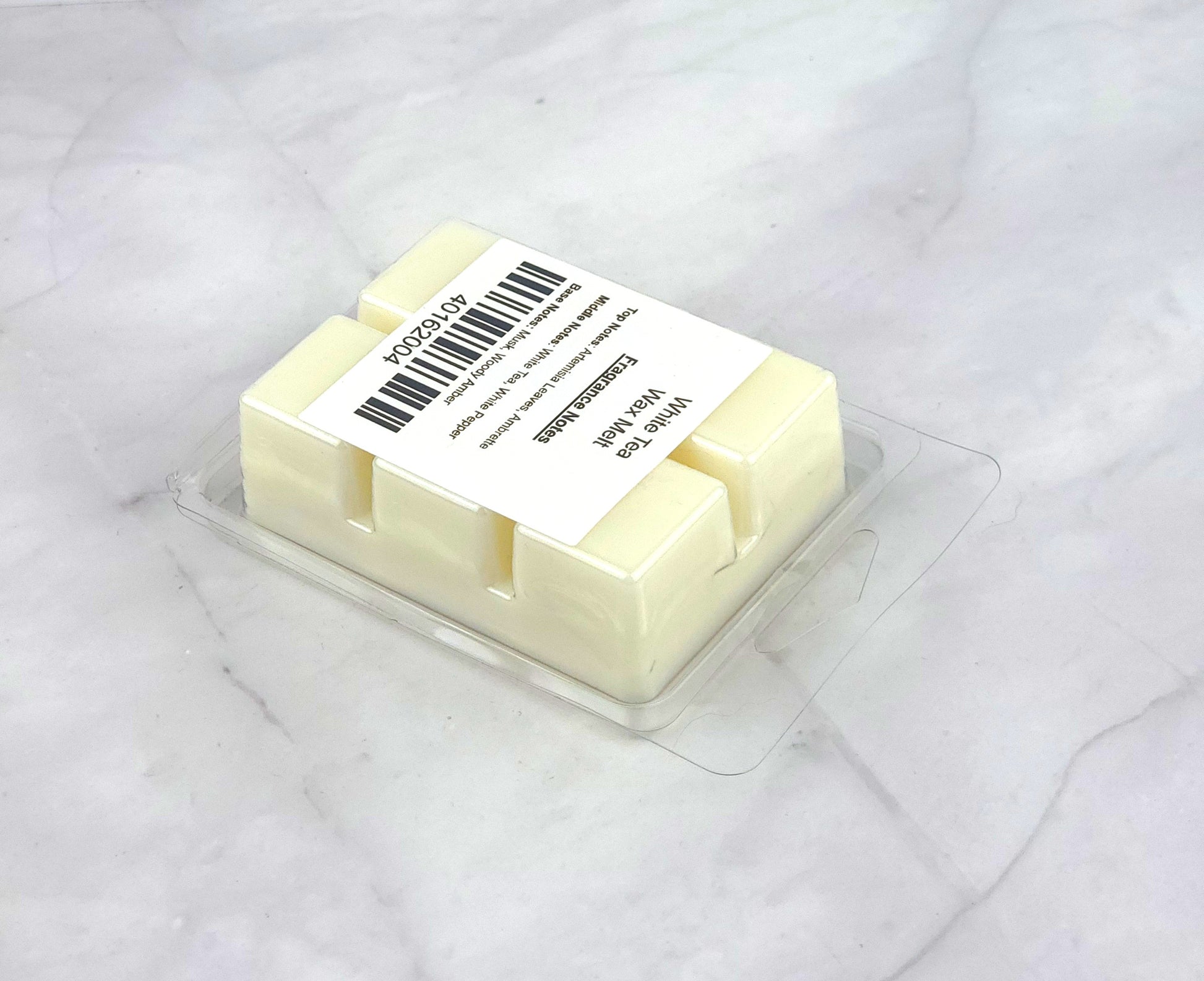 Luxurious White Tea Soy Wax Melt with herbaceous artemisia, white tea, and refined woody amber for a tranquil home ambiance.