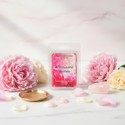 A Thousand Wishes Soy Wax Melt with floral, fruity, amber, and sandalwood fragrance displayed in an elegant decorative setting