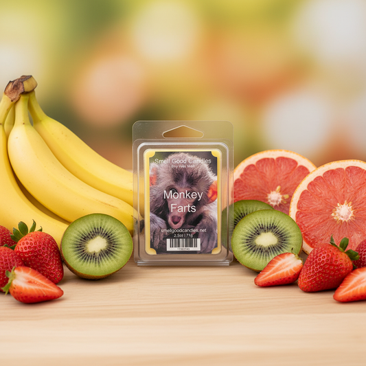 Monkey Farts Soy Wax Melt with banana, grapefruit, kiwi, and strawberry fragrance displayed alongside fresh fruit