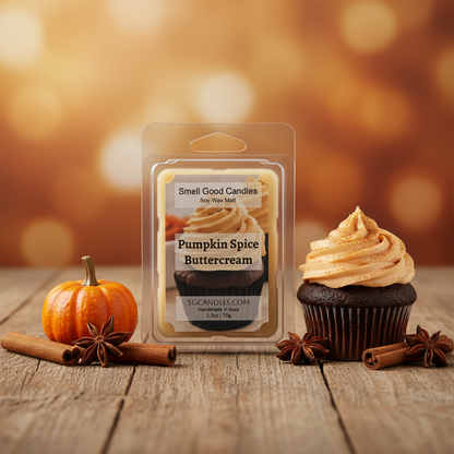 Pumpkin Spice Buttercream scented soy wax melt styled on a rustic wood surface with pumpkin, cinnamon sticks, and a buttercream cupcake in warm autumn golden light
